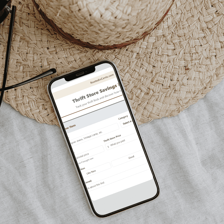 A screenshot of the thrift store saving estimator on a phone, next to a straw hat.